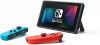 Nintendo Switch с парой неоново-красных Joy-Cons