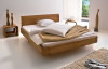 Кровать из натурального дерева в современном стиле